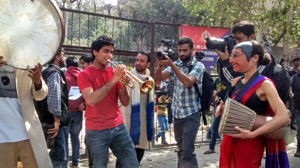 Protesters dancing, singing, making merry at Mandir Marg. 