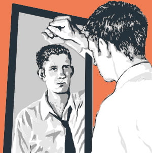 boy looking into mirror