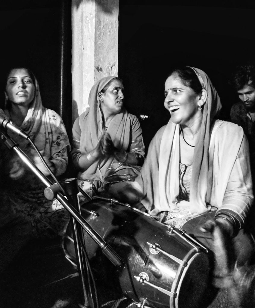 Women at Leisure: A group of women in the village got together in the nearest temple at 9PM to celebrate Janmastami, a Hindu festival. They celebrated Lord Krishna's birthday by singing and dancing together until midnight.