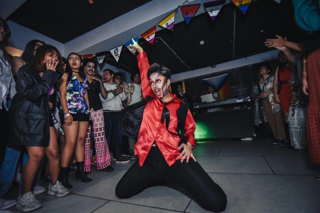 Drag King performing in front of crowed 