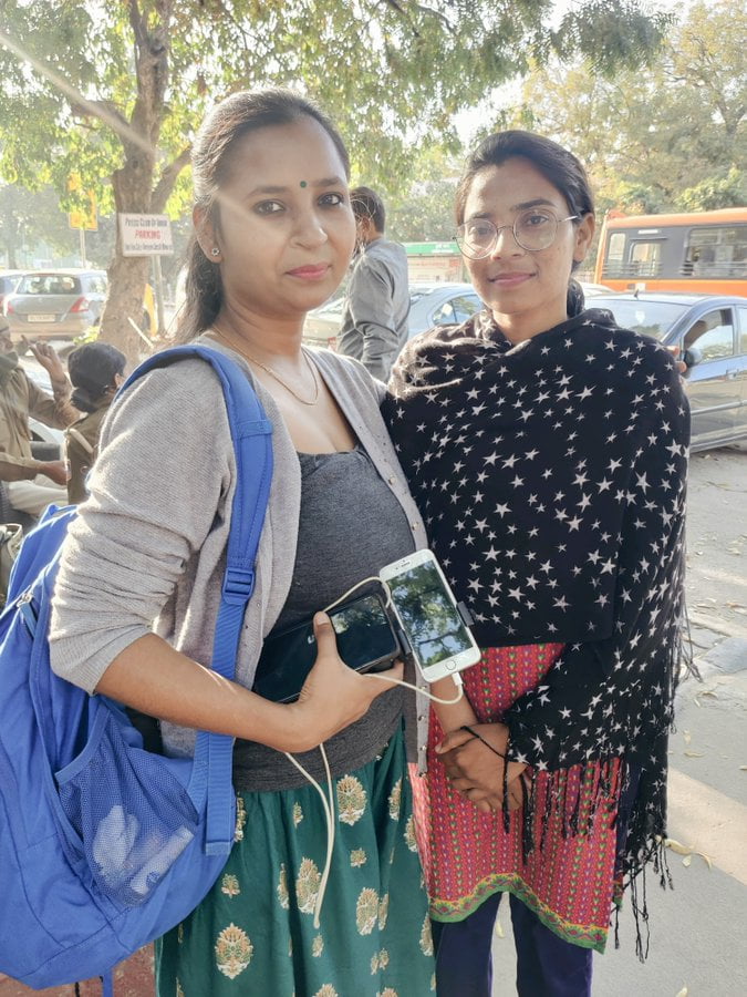 Meena Kotwal standing with a woman