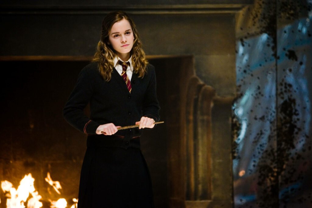JK Rowling's Hermione ,standing with magic wand, a still from the film. 