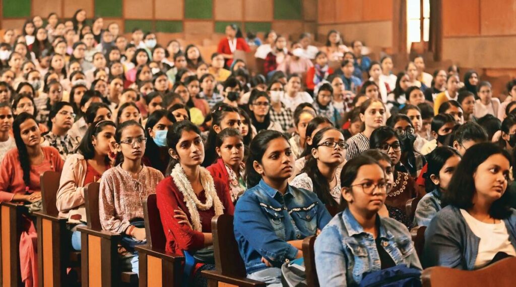 Girl Students sitting a hall in Delhi University 