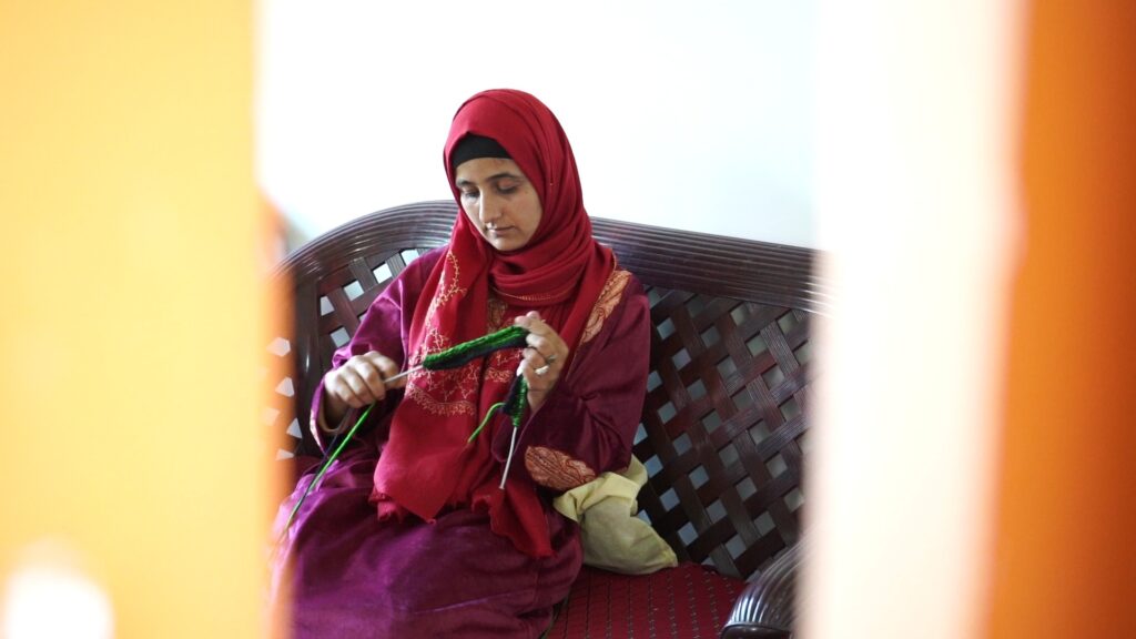 Gujjar women learning the art and craft of traditional Gujjar attire.