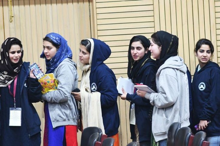 Kashmiri women waiting in a queue 