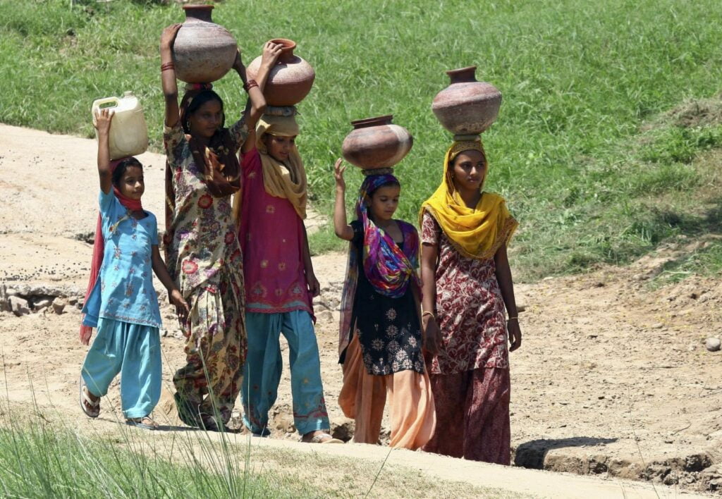Women carrying water pots