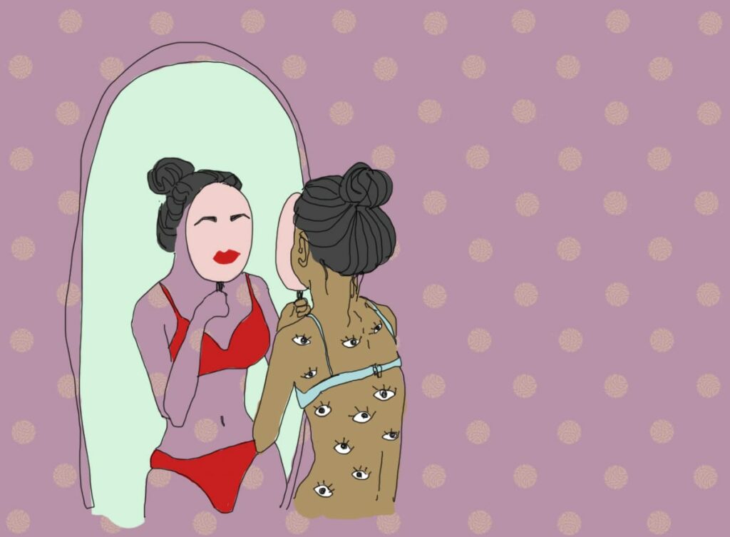 Image of a woman looking into the mirror