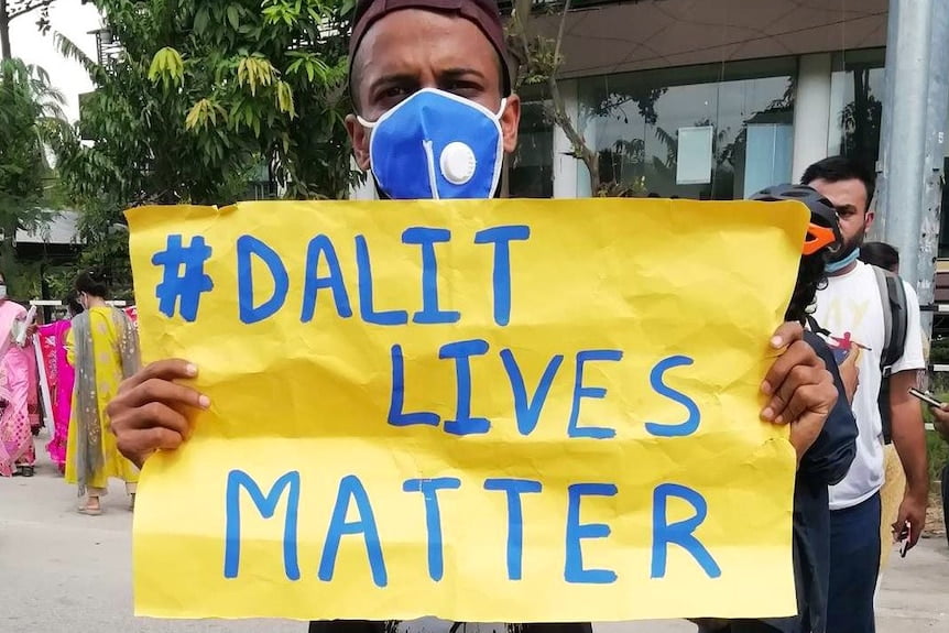 Man holding up Dalit Lives Matter poster
(Getty Images: David Talukdar/NurPhoto)