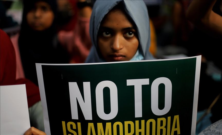 Woman protesting against Islamophobia 